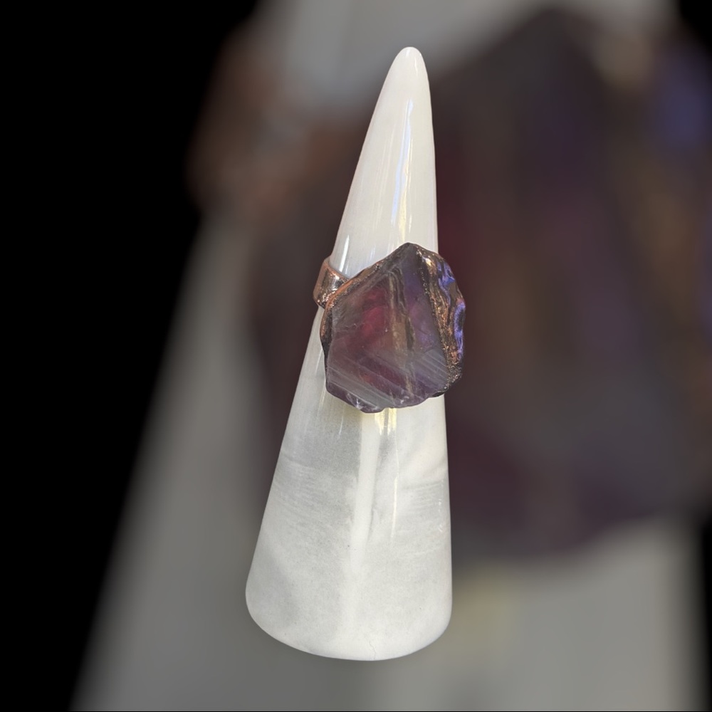 Raw purple stone ring set in bronze.
